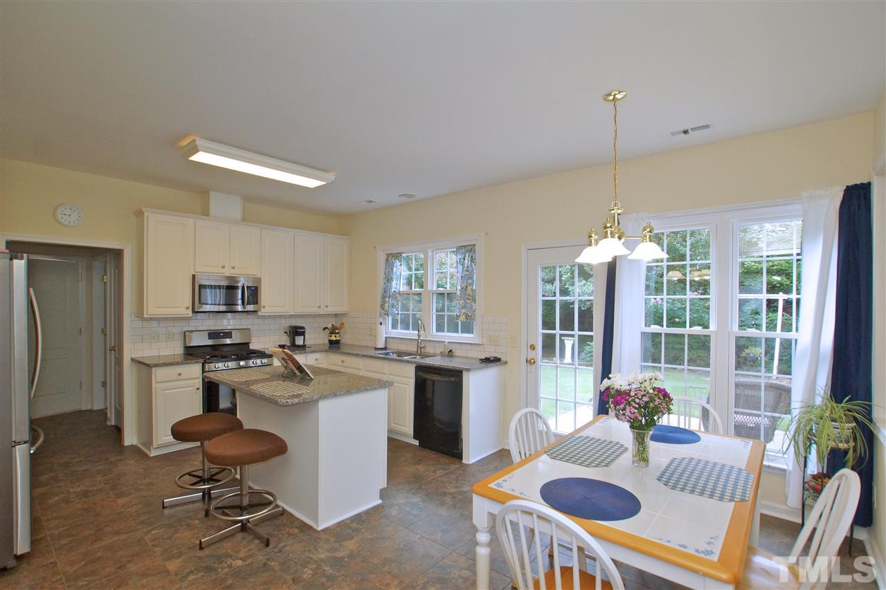 7540 Silver View Lane Raleigh, NC 27613 - Photo 9 of 29 Large eat-in kitchen with center island.