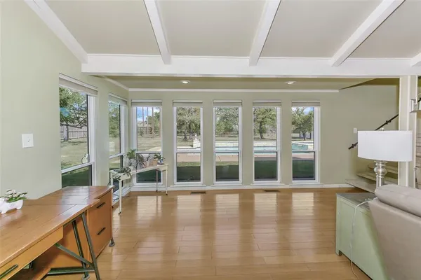 a view of a livingroom with furniture and a kitchen