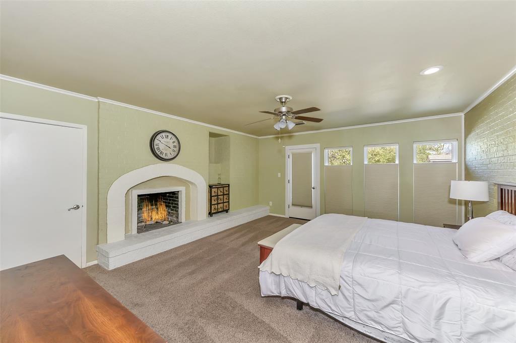 103 Robin Avenue Weatherford, TX 76086 - Photo 17 of 37 a spacious bedroom with a bed and a mirror