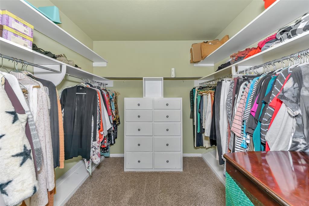 103 Robin Avenue Weatherford, TX 76086 - Photo 19 of 37 a view of walk in closet with clothes