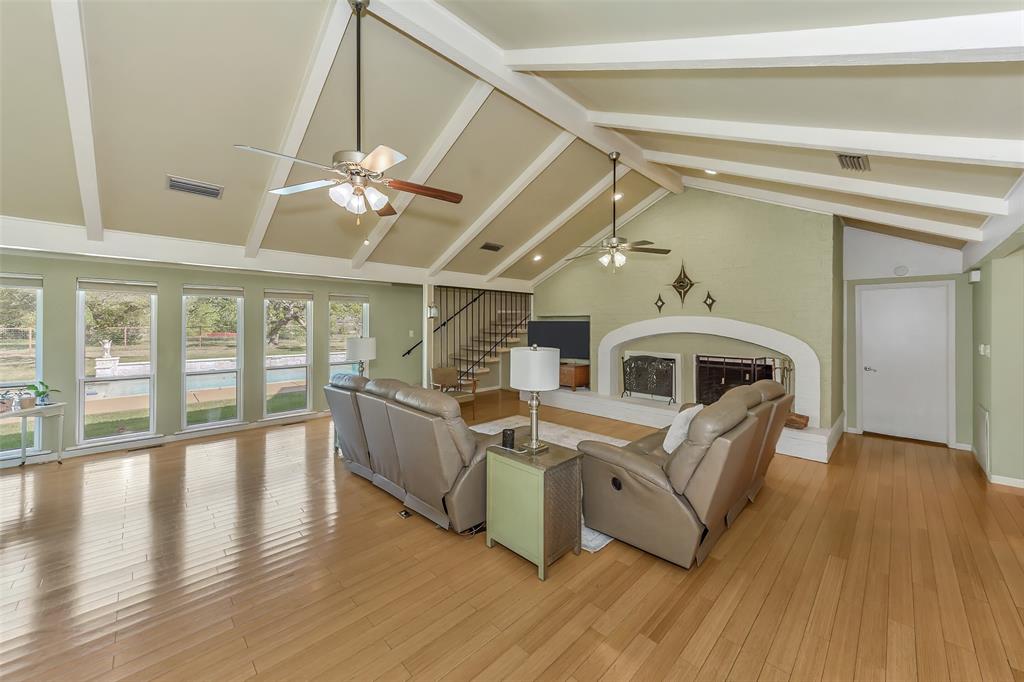 103 Robin Avenue Weatherford, TX 76086 - Photo 7 of 37 a view of a house with a large window with wooden floor