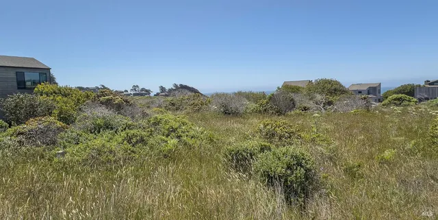 a view of a large building with a mountain in the background