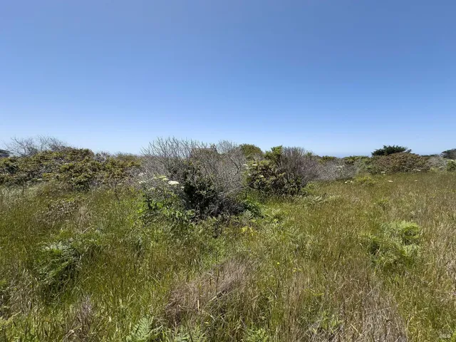 a view of mountain with sunset