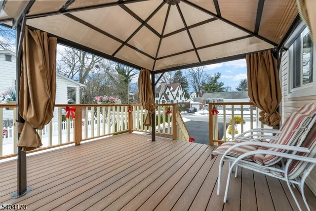 a view of a balcony with wooden floor