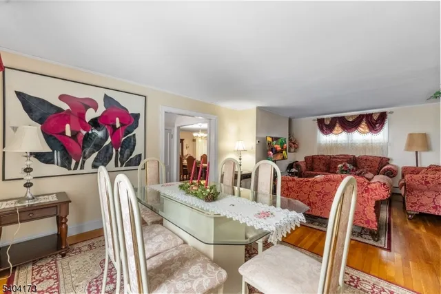 a view of a livingroom with furniture and a flat screen tv