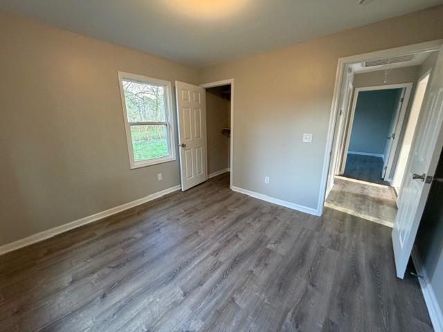 756 Old Summerville Road Northwest Rome, GA 30165 - Photo 19 of 21 an empty room with wooden floor and a window