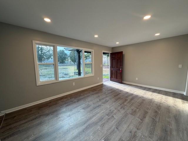 756 Old Summerville Road Northwest Rome, GA 30165 - Photo 6 of 21 an empty room with wooden floor and windows