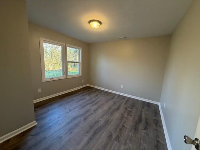 756 Old Summerville Road Northwest Rome, GA 30165 - Photo 9 of 21 an empty room with wooden floor and windows