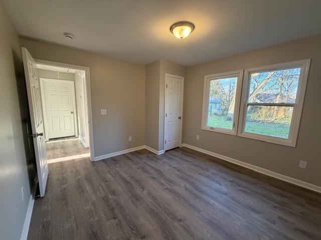 756 Old Summerville Road Northwest Rome, GA 30165 - Photo 10 of 21 an empty room with wooden floor and windows
