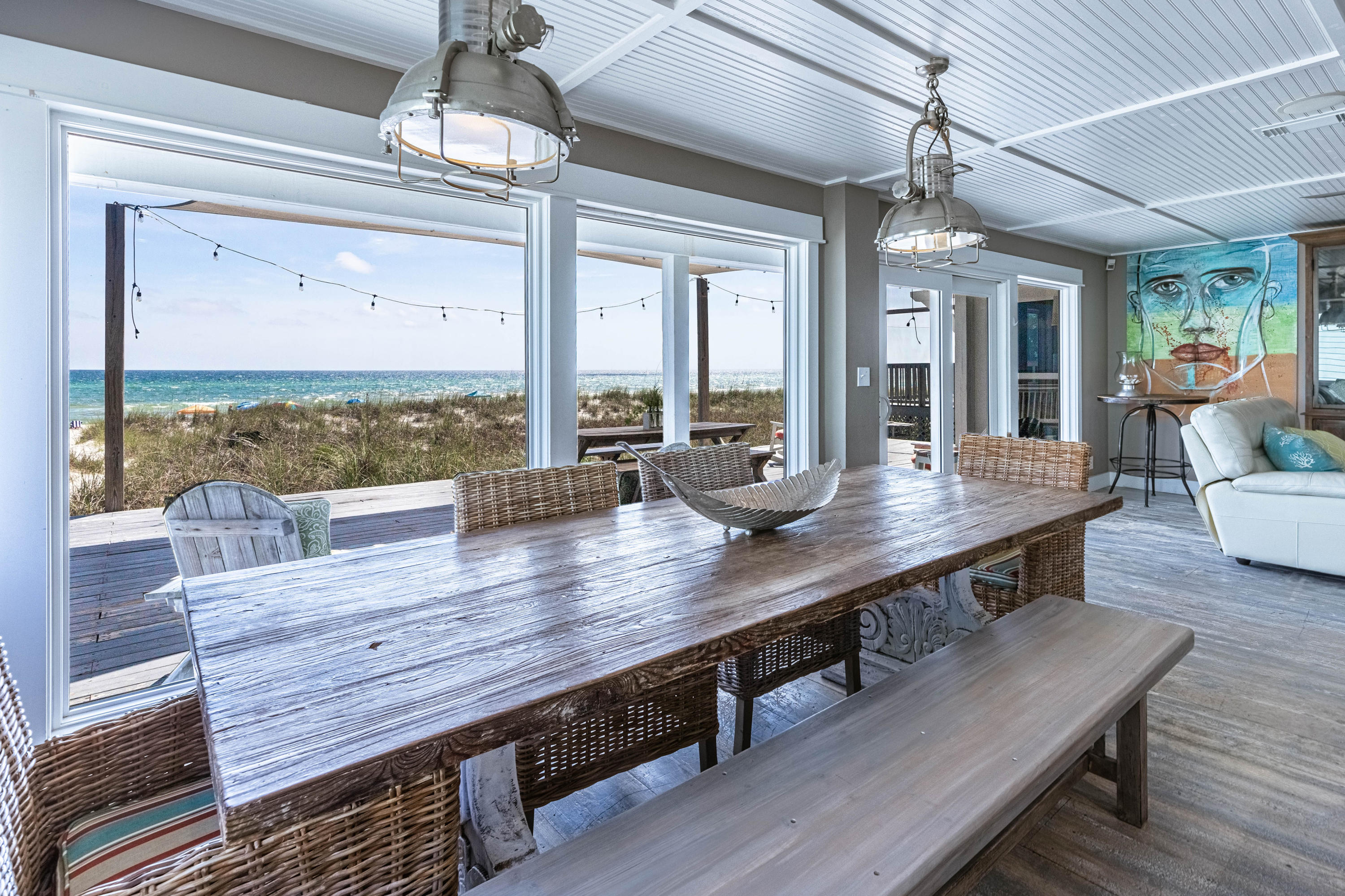 17807 Front Beach Road Panama City Beach, FL 32413 - Photo 1 of 17 a view of a dining room with furniture window and wooden floor
