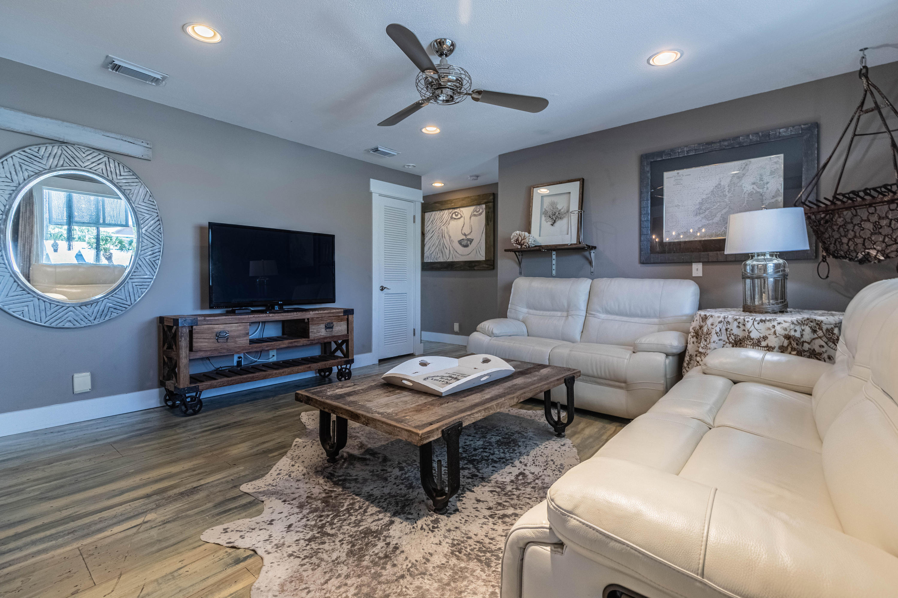 17807 Front Beach Road Panama City Beach, FL 32413 - Photo 12 of 17 a living room with furniture a window and a flat screen tv