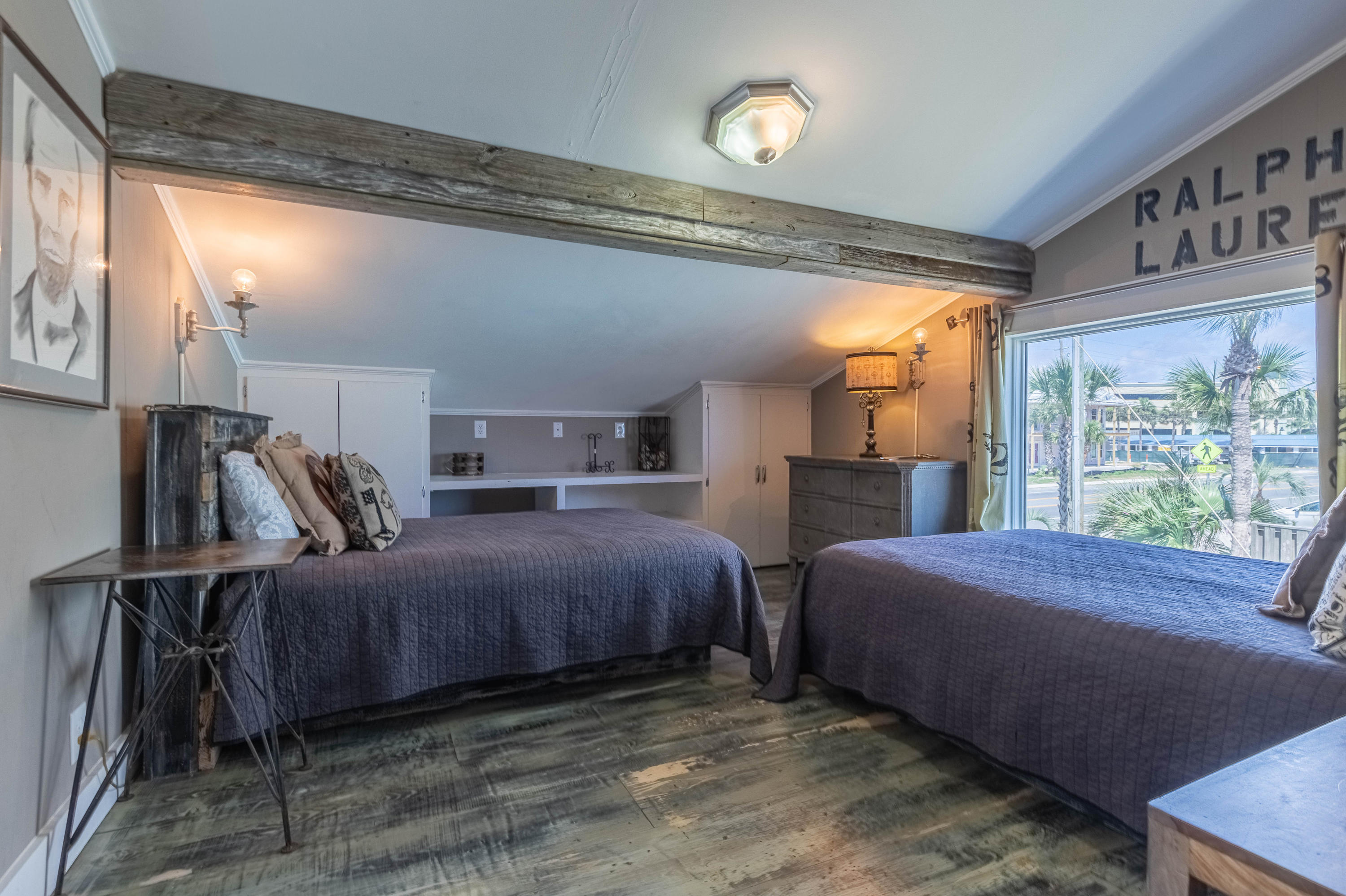 17807 Front Beach Road Panama City Beach, FL 32413 - Photo 14 of 17 a bedroom with a bed next to a window