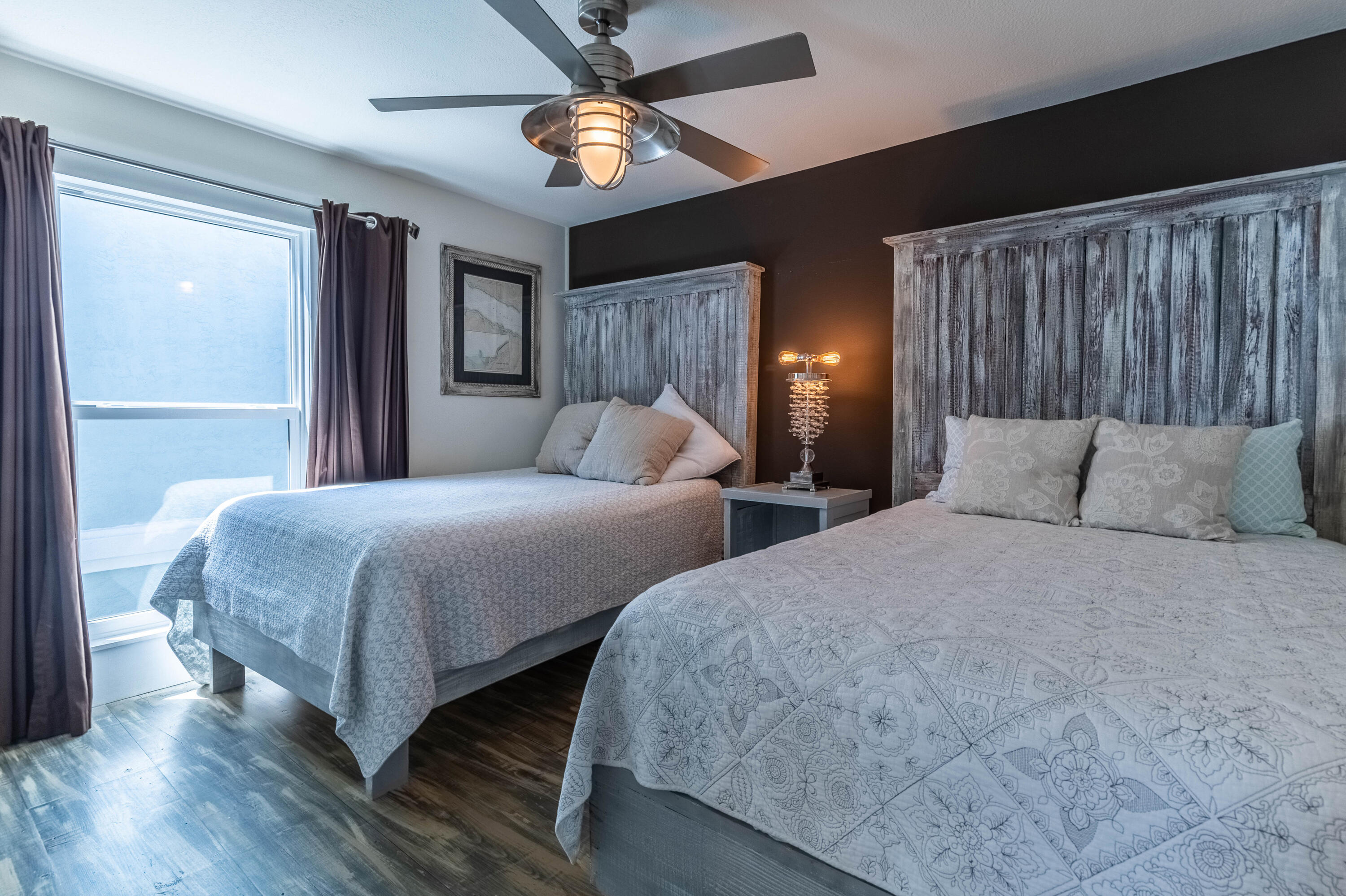 17807 Front Beach Road Panama City Beach, FL 32413 - Photo 15 of 17 a bedroom with two beds and a chandelier