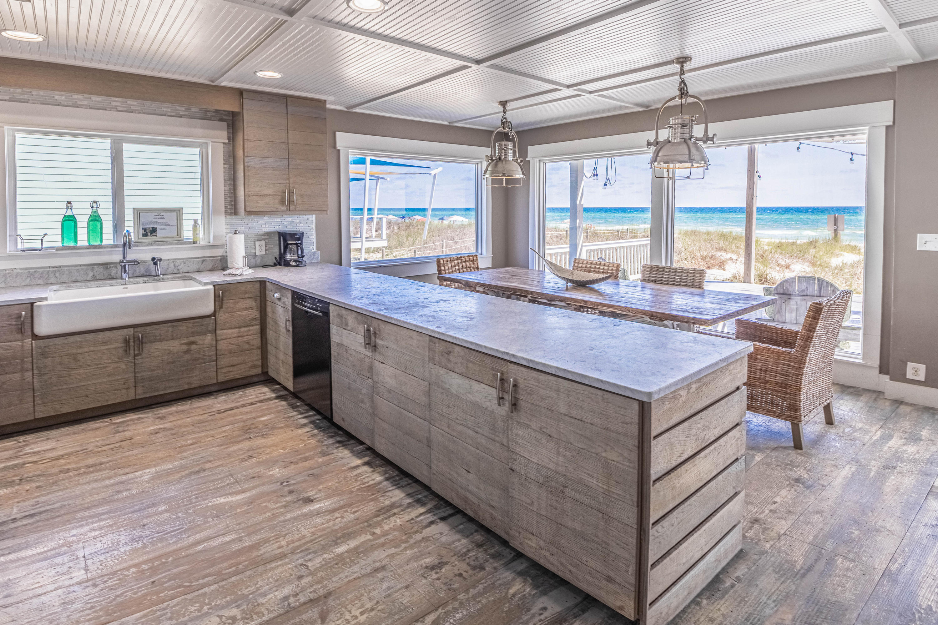 17807 Front Beach Road Panama City Beach, FL 32413 - Photo 6 of 17 a kitchen with sink cabinets and wooden floor
