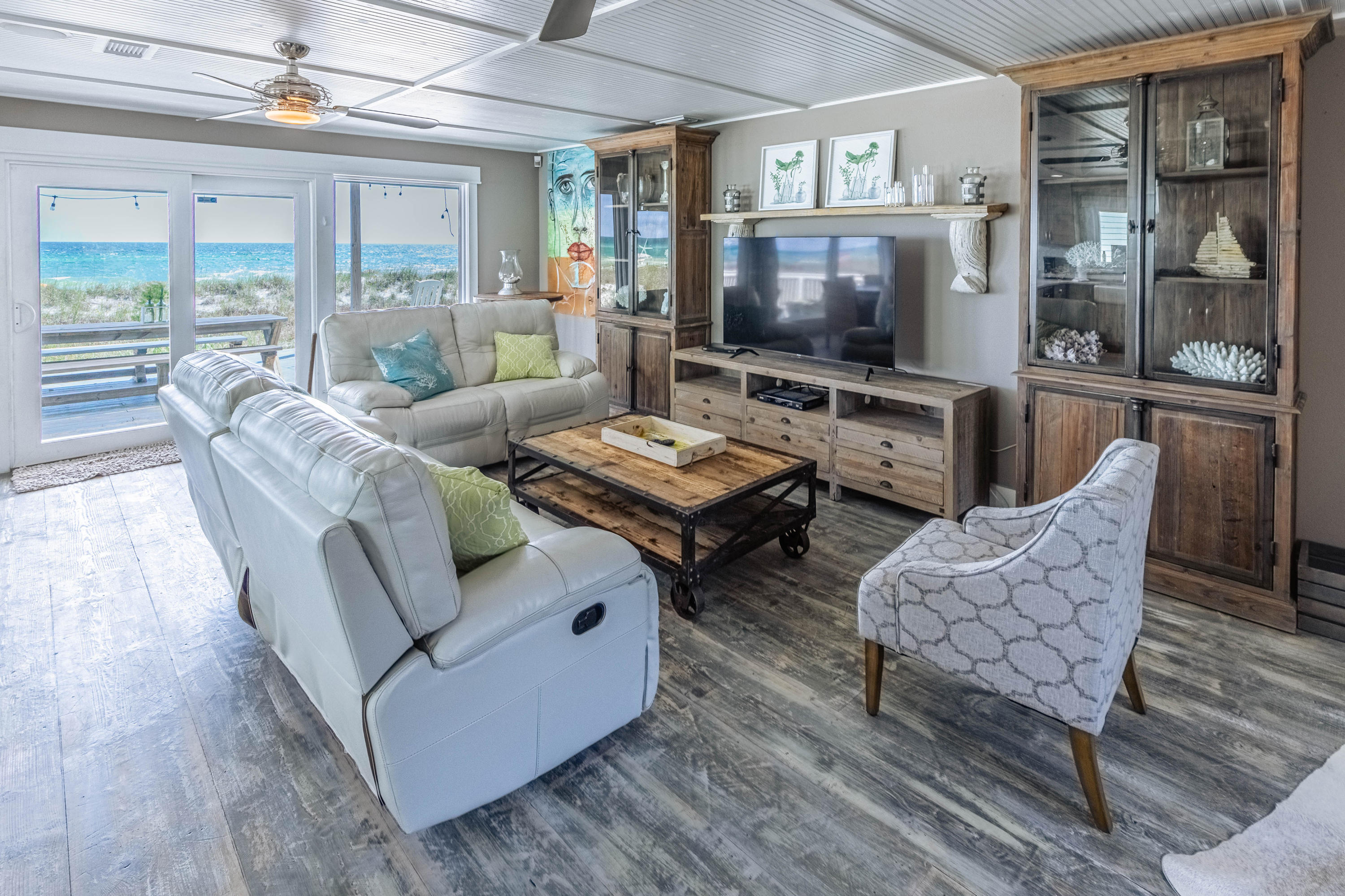 17807 Front Beach Road Panama City Beach, FL 32413 - Photo 7 of 17 a living room with furniture and a flat screen tv