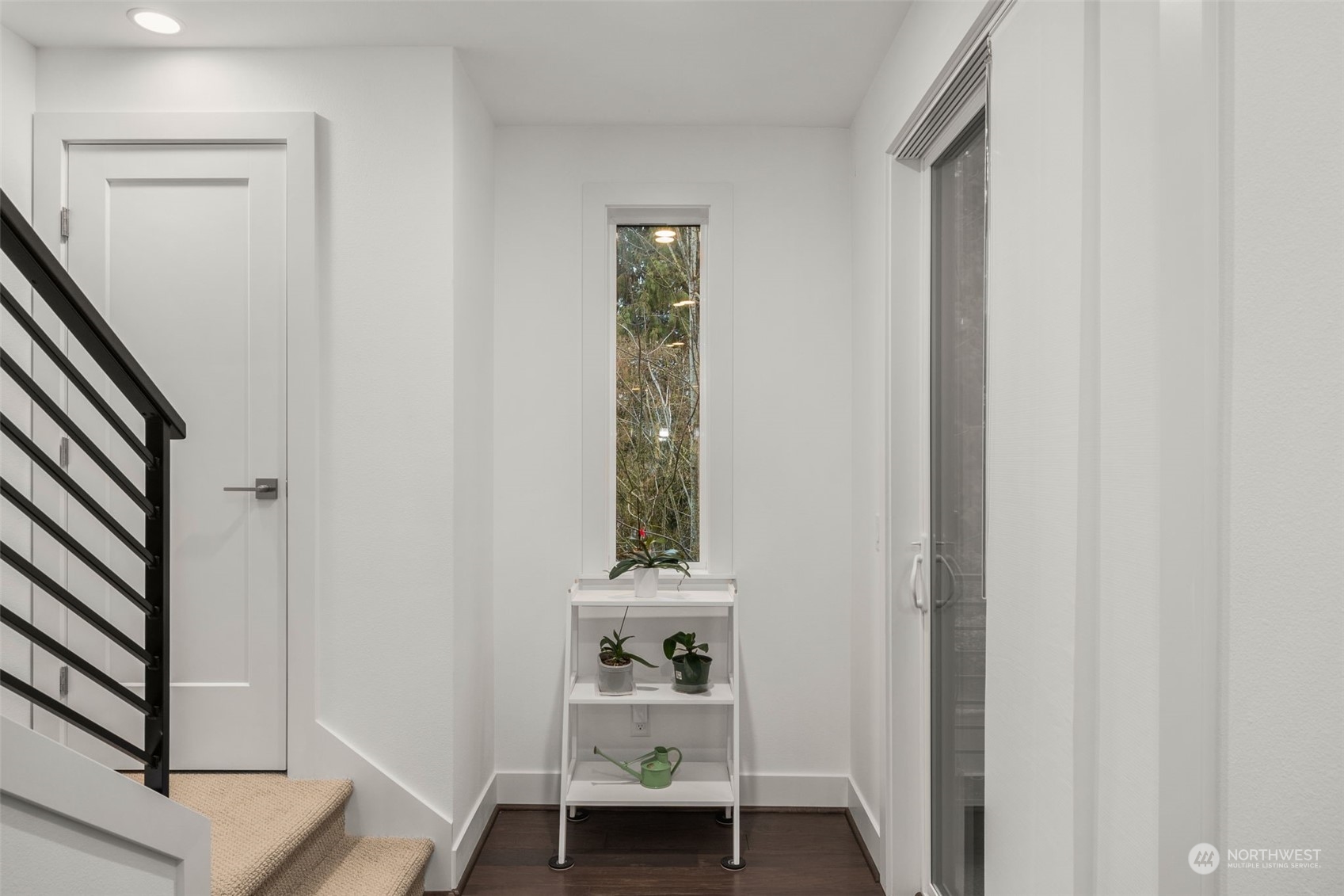 9604 Main Street, Unit B Bothell, WA 98011 - Photo 14 of 34 a view of a hallway with wooden floor and a bathroom