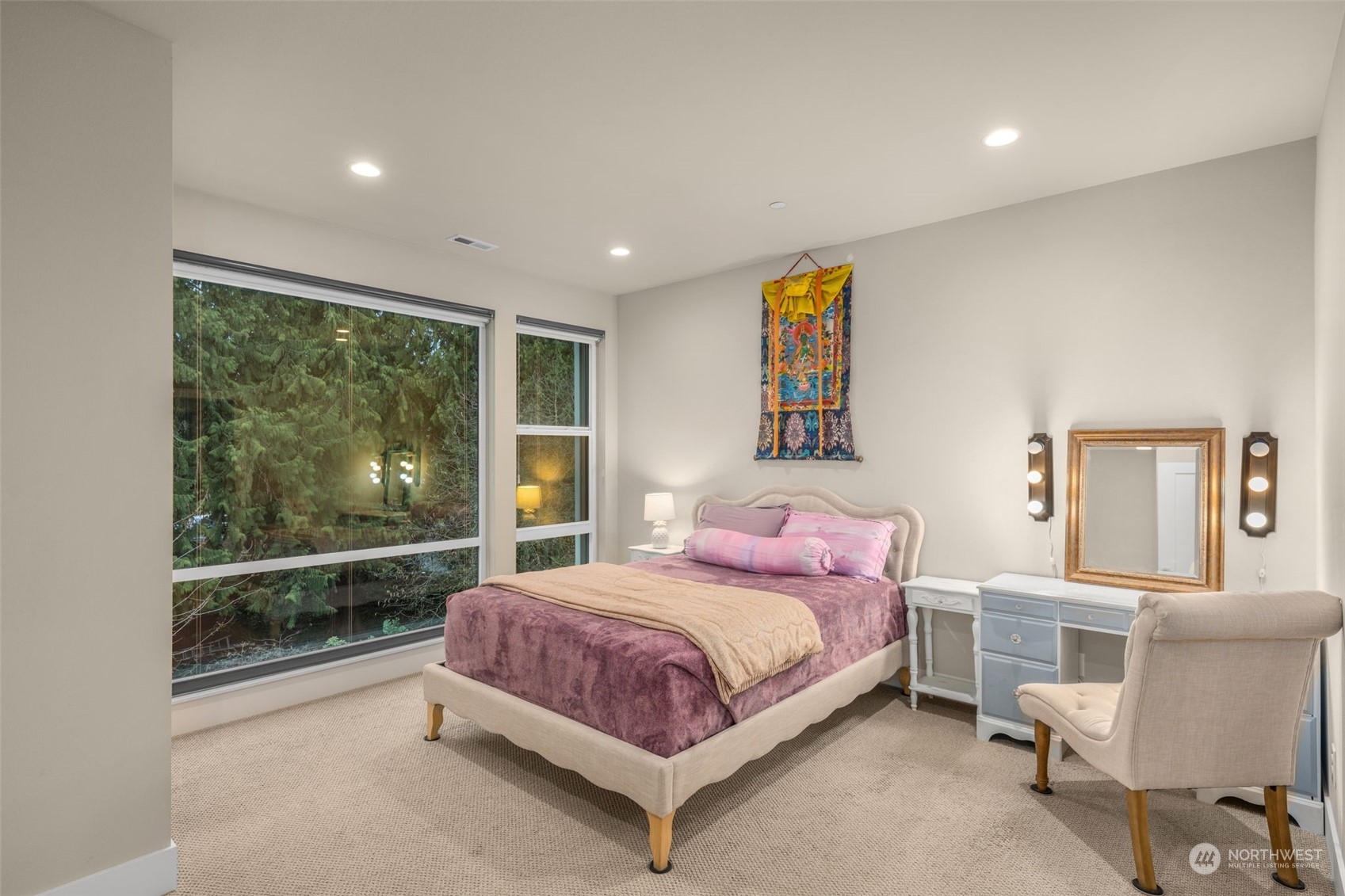 9604 Main Street, Unit B Bothell, WA 98011 - Photo 15 of 34 a bedroom with a bed and glass window