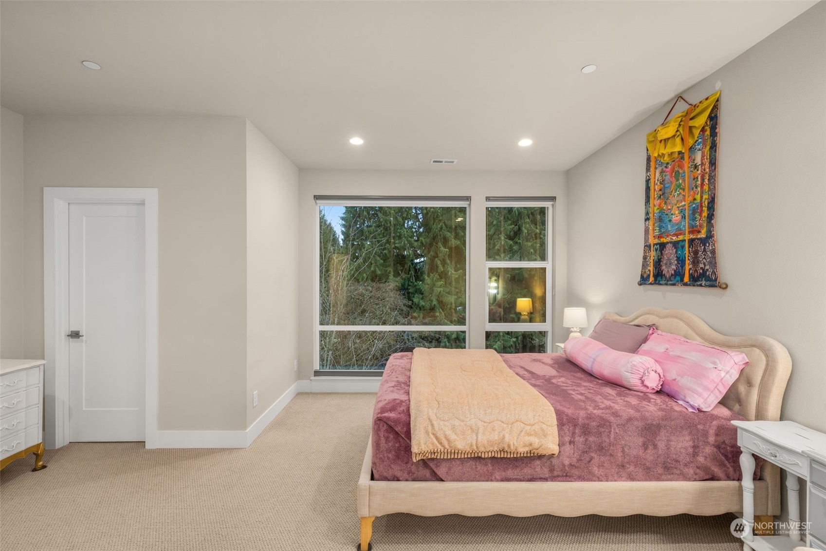 9604 Main Street, Unit B Bothell, WA 98011 - Photo 16 of 34 a bedroom with a large bed and a large window