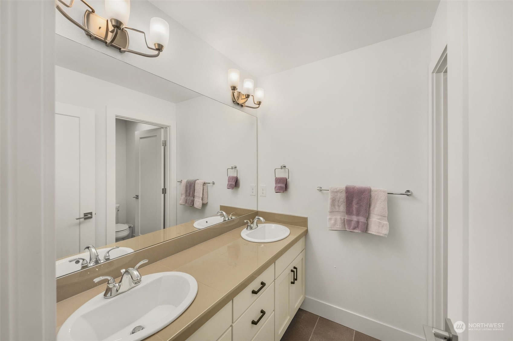9604 Main Street, Unit B Bothell, WA 98011 - Photo 20 of 34 a bathroom with a sink and a mirror