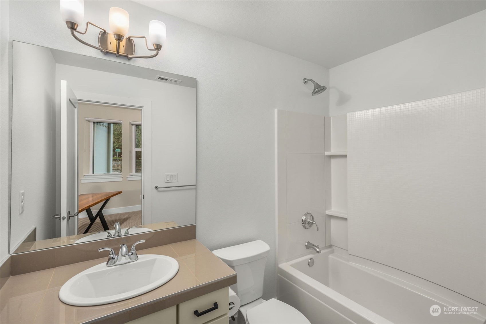 9604 Main Street, Unit B Bothell, WA 98011 - Photo 22 of 34 a bathroom with a granite countertop sink a toilet a mirror and shower