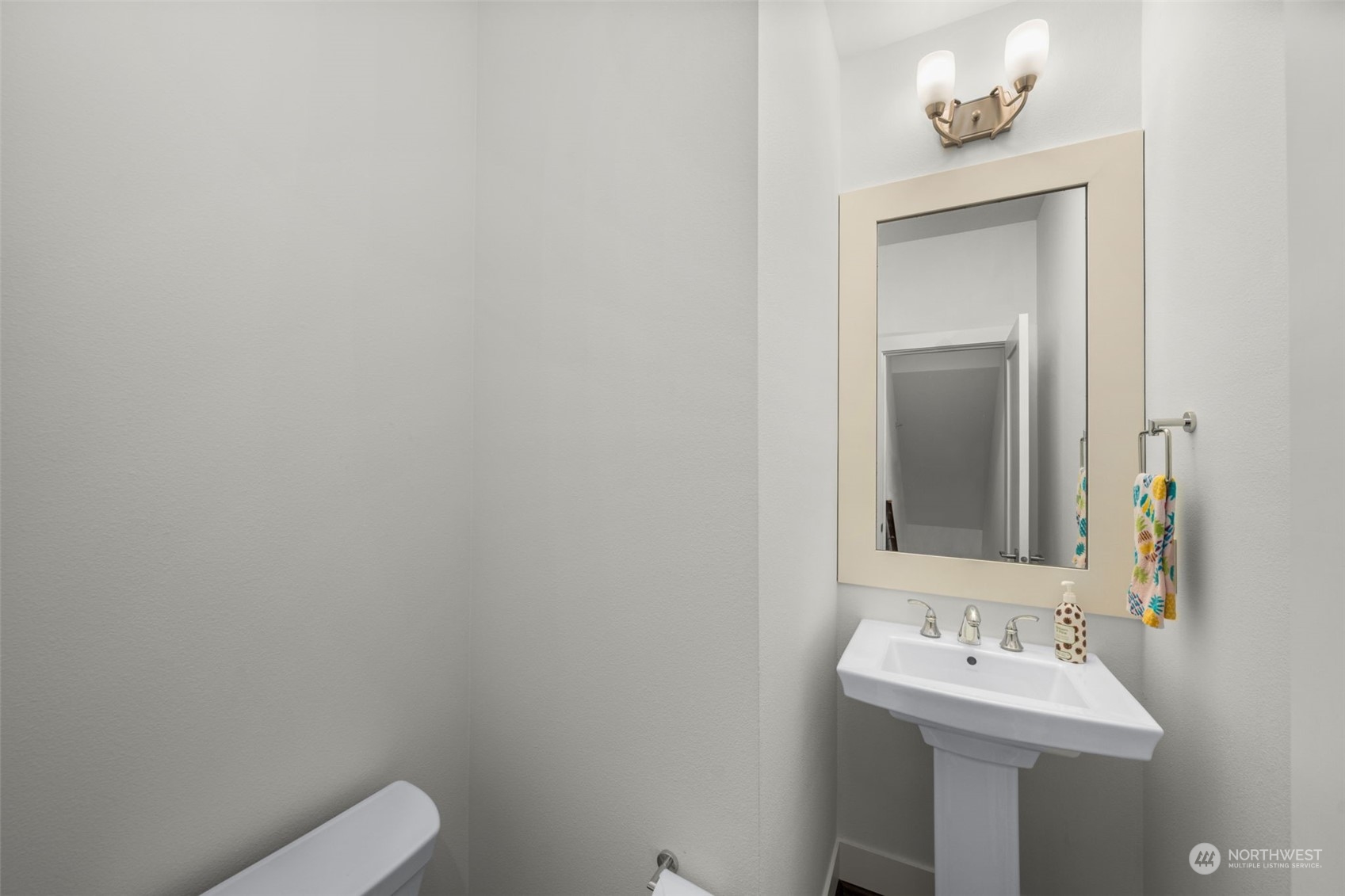 9604 Main Street, Unit B Bothell, WA 98011 - Photo 26 of 34 a bathroom with a sink mirror and toilet
