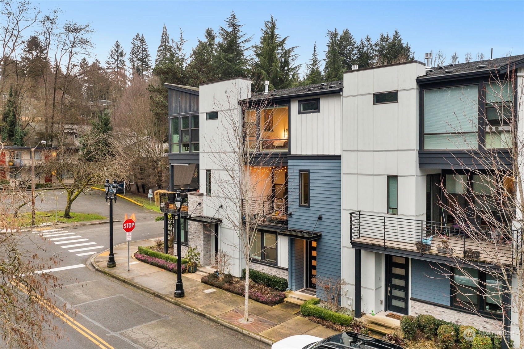 9604 Main Street, Unit B Bothell, WA 98011 - Photo 31 of 34 a small white building with a white roof and a small yard