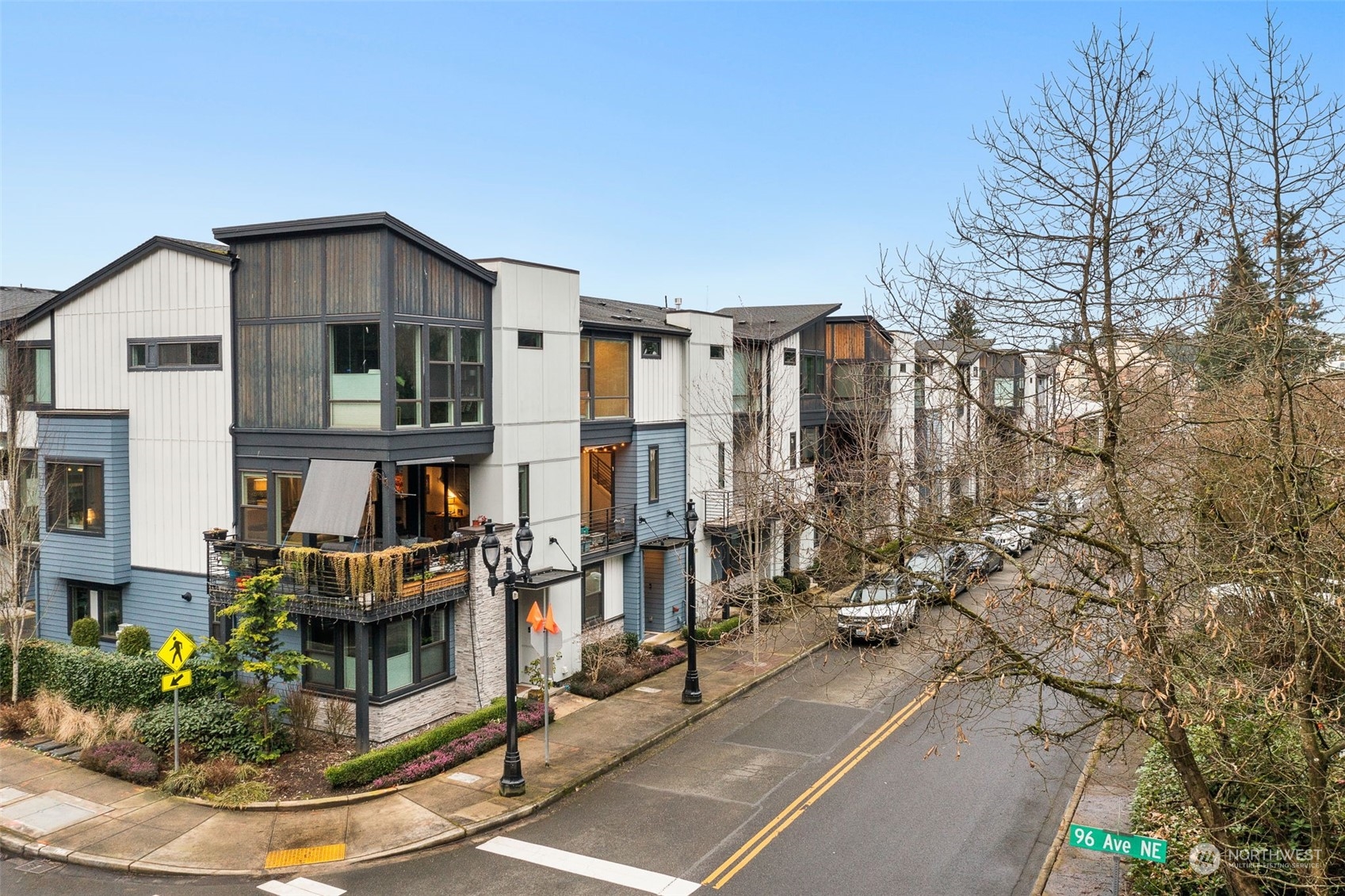 9604 Main Street, Unit B Bothell, WA 98011 - Photo 32 of 34 a view of residential houses with cars parked on the road