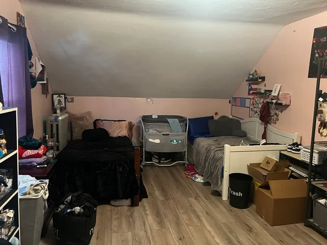 a bedroom with a bed and a desk