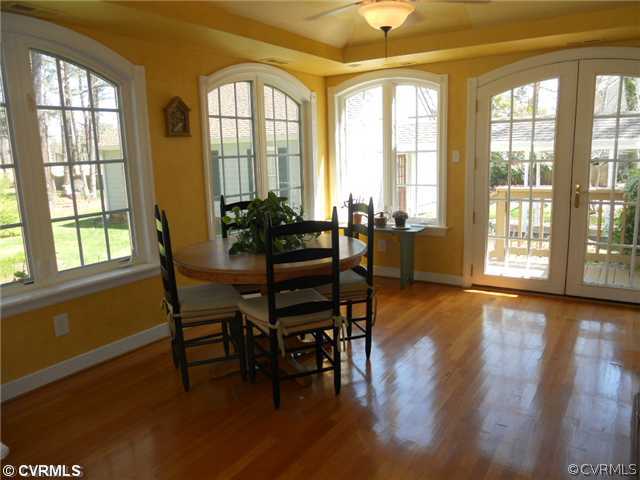 2551 Kentford Road Midlothian, VA 23113 - Photo 6 of 12 a dining room with wooden floor and furniture