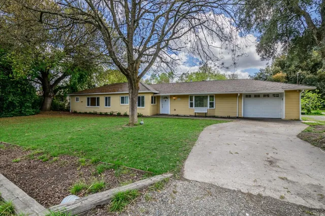 front view of a house with a yard