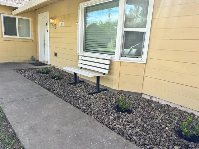 a room that has a bed and a table in it