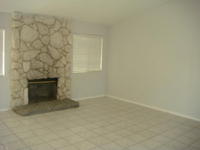 67235 Verona Road Cathedral City, CA 92234 - Photo 6 of 14 an empty room with a fireplace