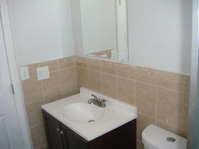 67235 Verona Road Cathedral City, CA 92234 - Photo 9 of 14 a bathroom with a sink a toilet and a mirror