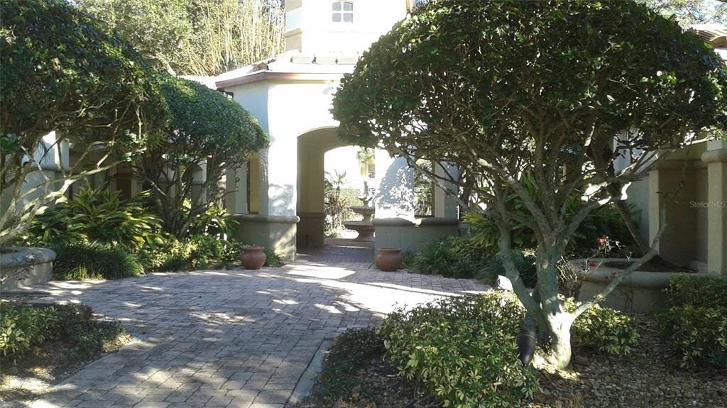 829 Camargo Way, Unit 203 Altamonte Springs, FL 32714 - Photo 11 of 26 a view of a yard with plants and trees