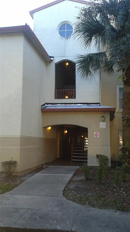 829 Camargo Way, Unit 203 Altamonte Springs, FL 32714 - Photo 12 of 26 a front view of a house with parking space