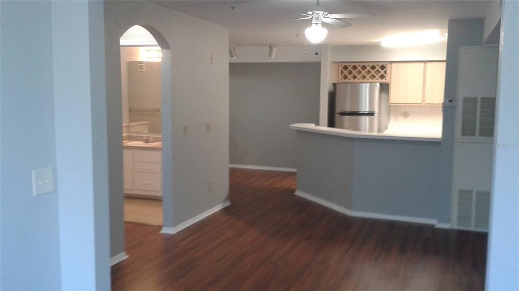 829 Camargo Way, Unit 203 Altamonte Springs, FL 32714 - Photo 16 of 26 a view of hallway with wooden floor