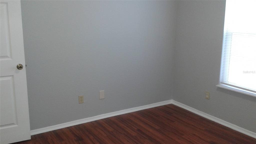 829 Camargo Way, Unit 203 Altamonte Springs, FL 32714 - Photo 20 of 26 a view of a small space with wooden floor and a window