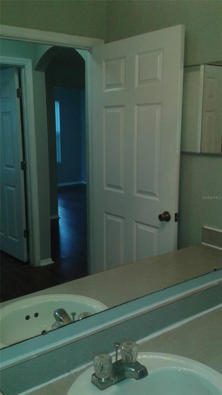 829 Camargo Way, Unit 203 Altamonte Springs, FL 32714 - Photo 23 of 26 a bathroom with a bathtub and a sink