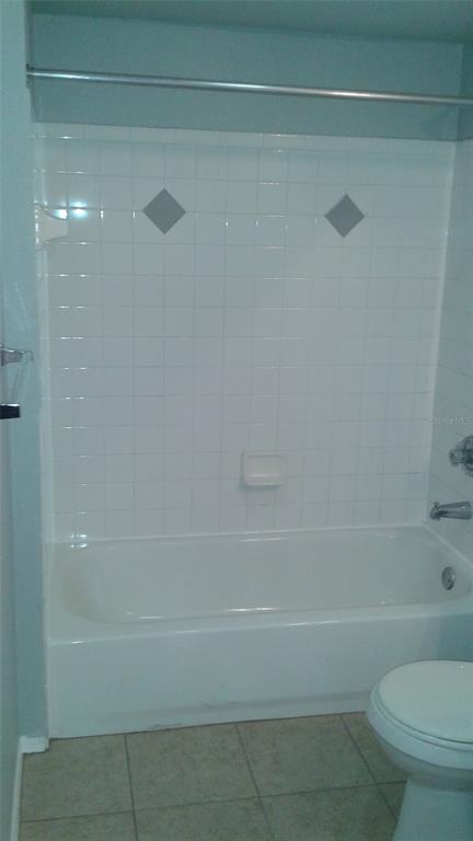 829 Camargo Way, Unit 203 Altamonte Springs, FL 32714 - Photo 24 of 26 a bathroom with a toilet and a bathtub