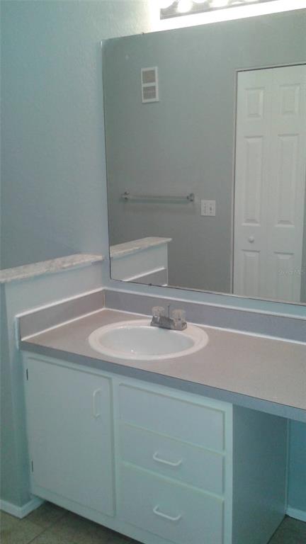 829 Camargo Way, Unit 203 Altamonte Springs, FL 32714 - Photo 25 of 26 a bathroom with a sink and a mirror