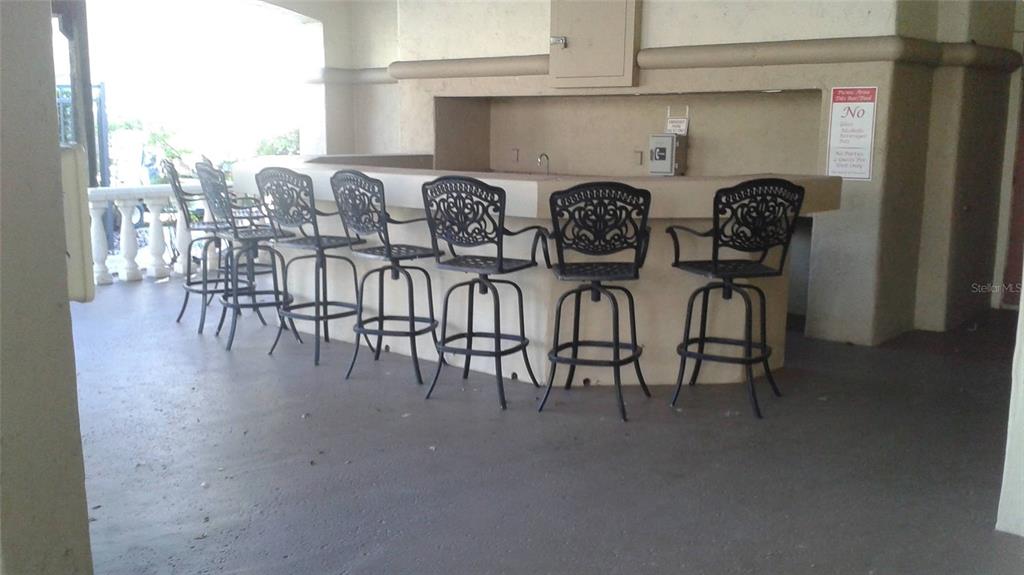 829 Camargo Way, Unit 203 Altamonte Springs, FL 32714 - Photo 5 of 26 a view of a room with lots of wooden furniture and windows