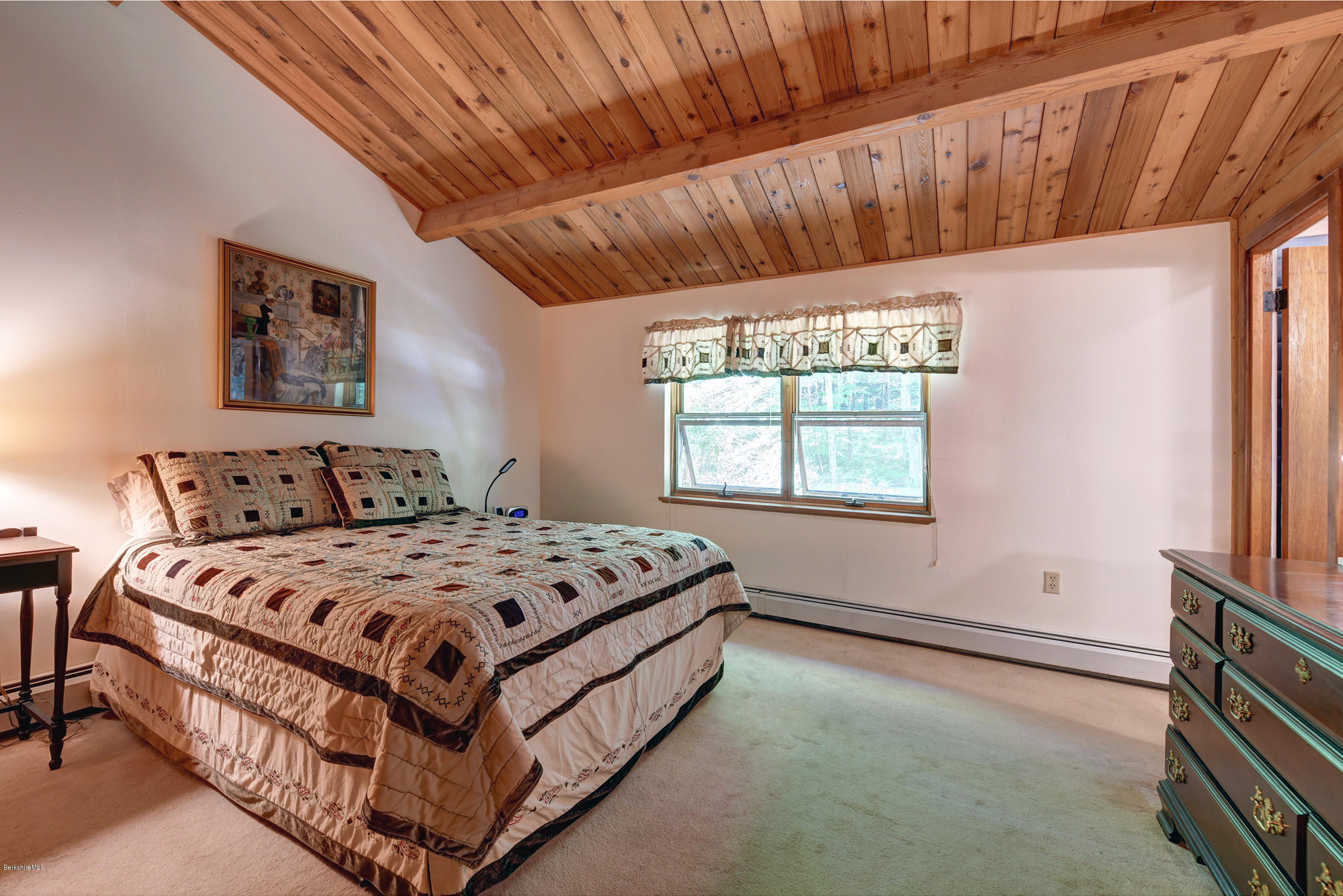 2399 Swamp Road Richmond, MA 01254 - Photo 18 of 36 a bed sitting in a bedroom next to a window