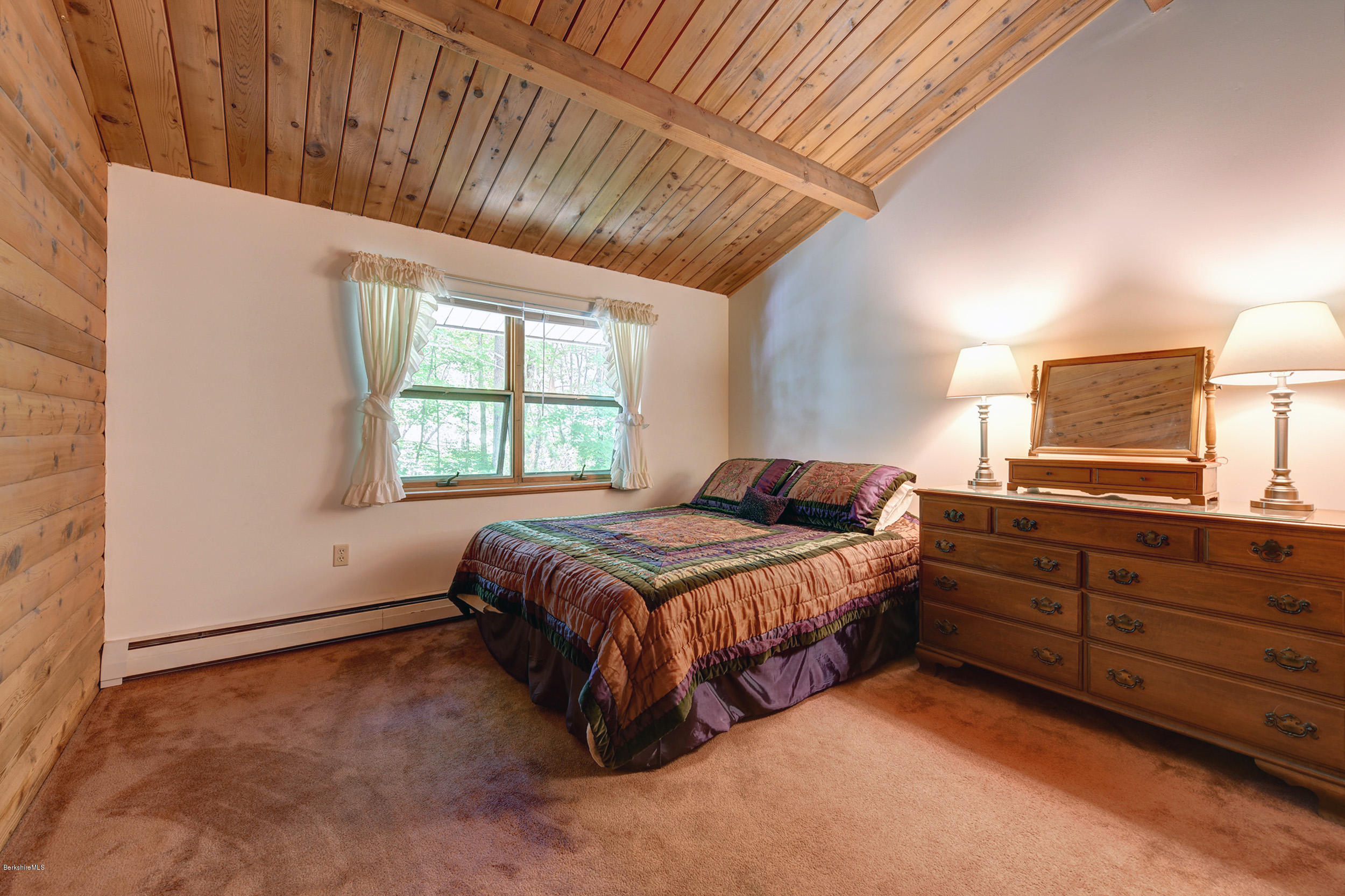 2399 Swamp Road Richmond, MA 01254 - Photo 21 of 36 a spacious bedroom with a large bed and a window