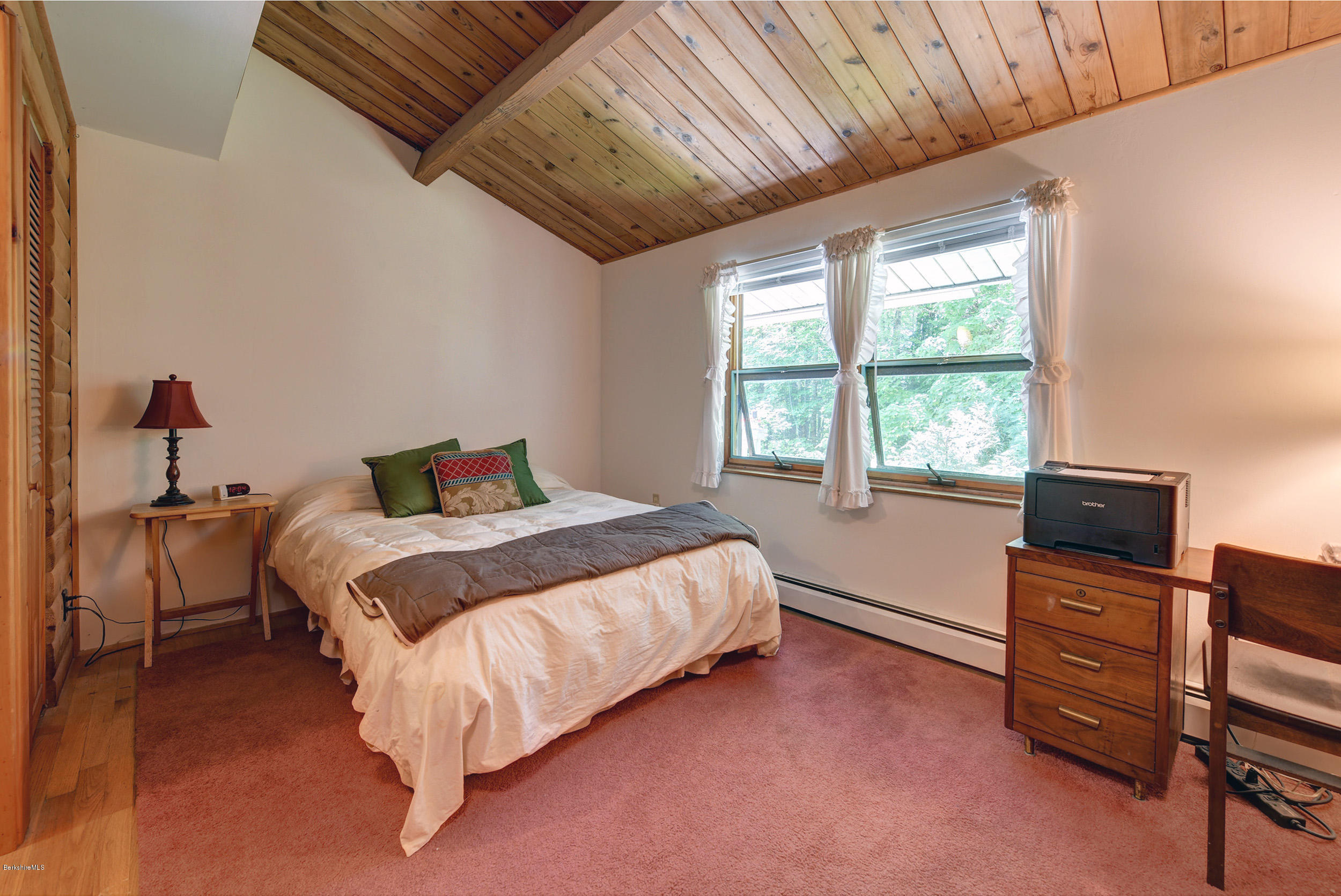 2399 Swamp Road Richmond, MA 01254 - Photo 23 of 36 a bed sitting in a bedroom next to a window