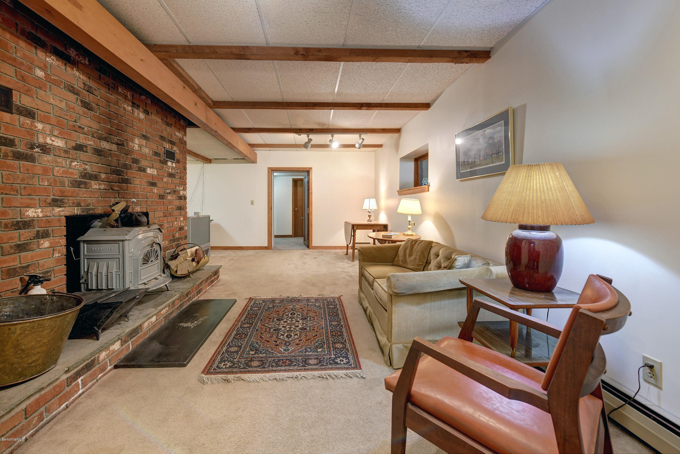 2399 Swamp Road Richmond, MA 01254 - Photo 27 of 36 a living room with furniture and a flat screen tv