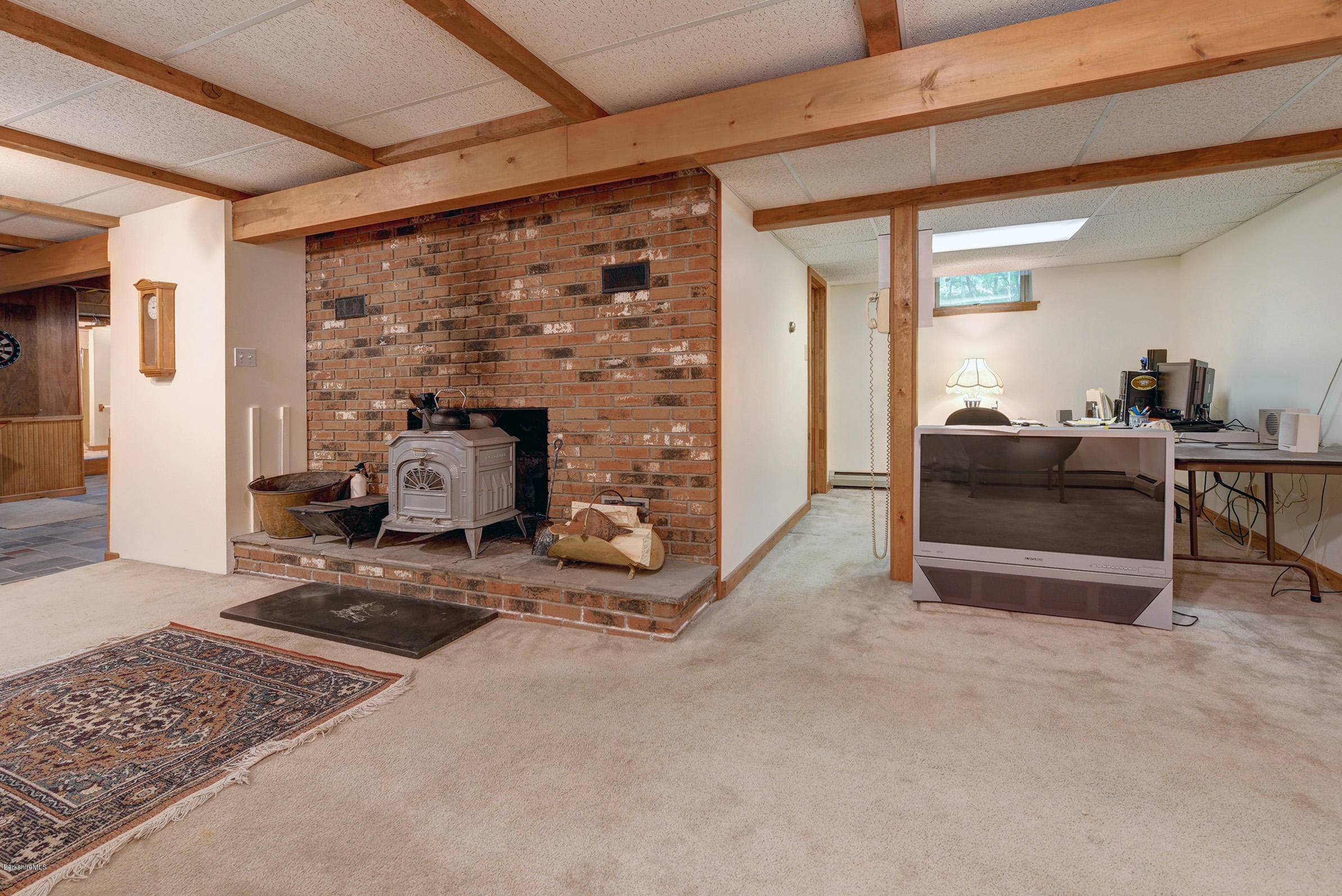 2399 Swamp Road Richmond, MA 01254 - Photo 28 of 36 a living room with furniture and a fireplace