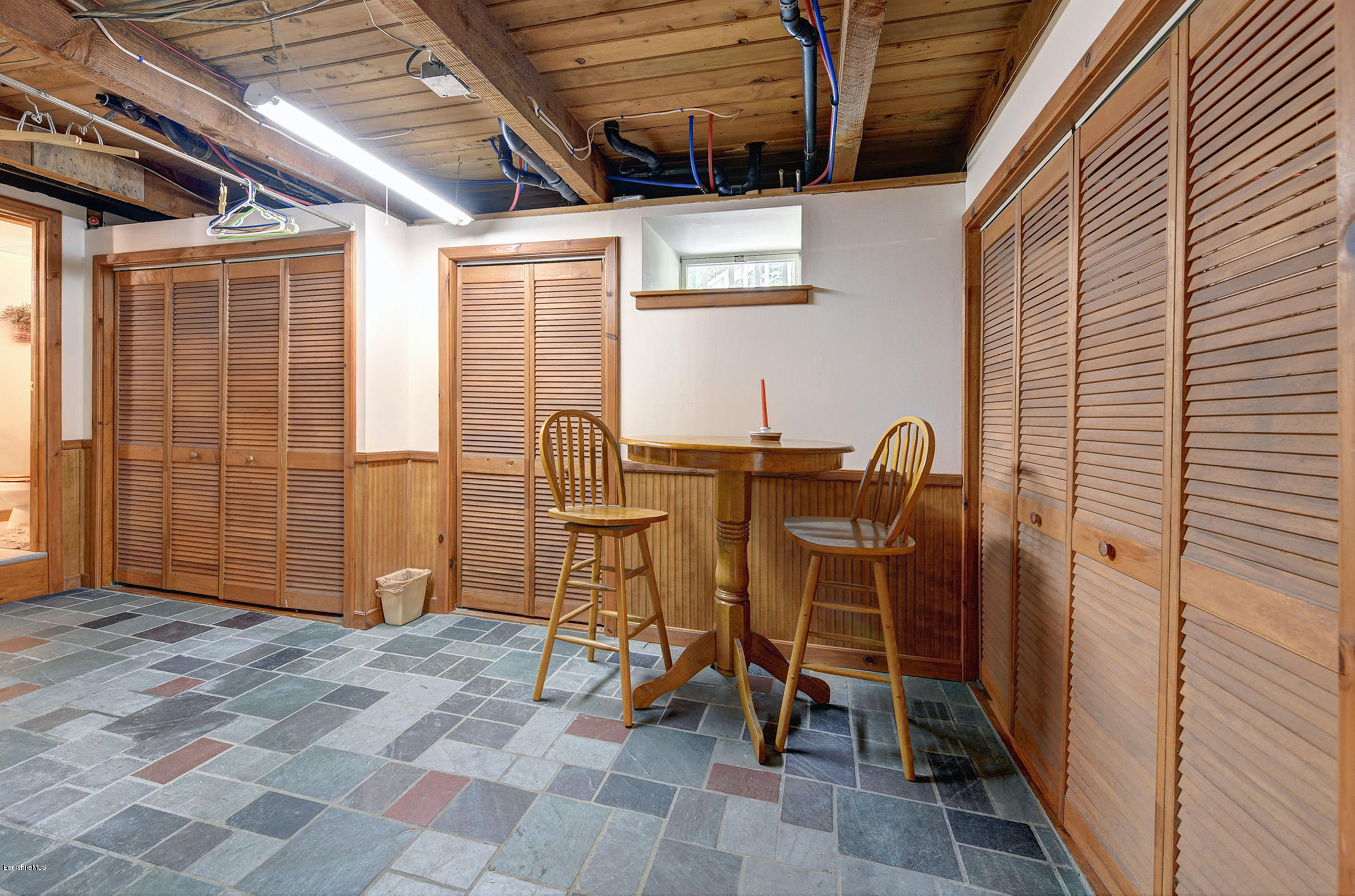 2399 Swamp Road Richmond, MA 01254 - Photo 31 of 36 a view of a patio with table and chairs and wooden floor