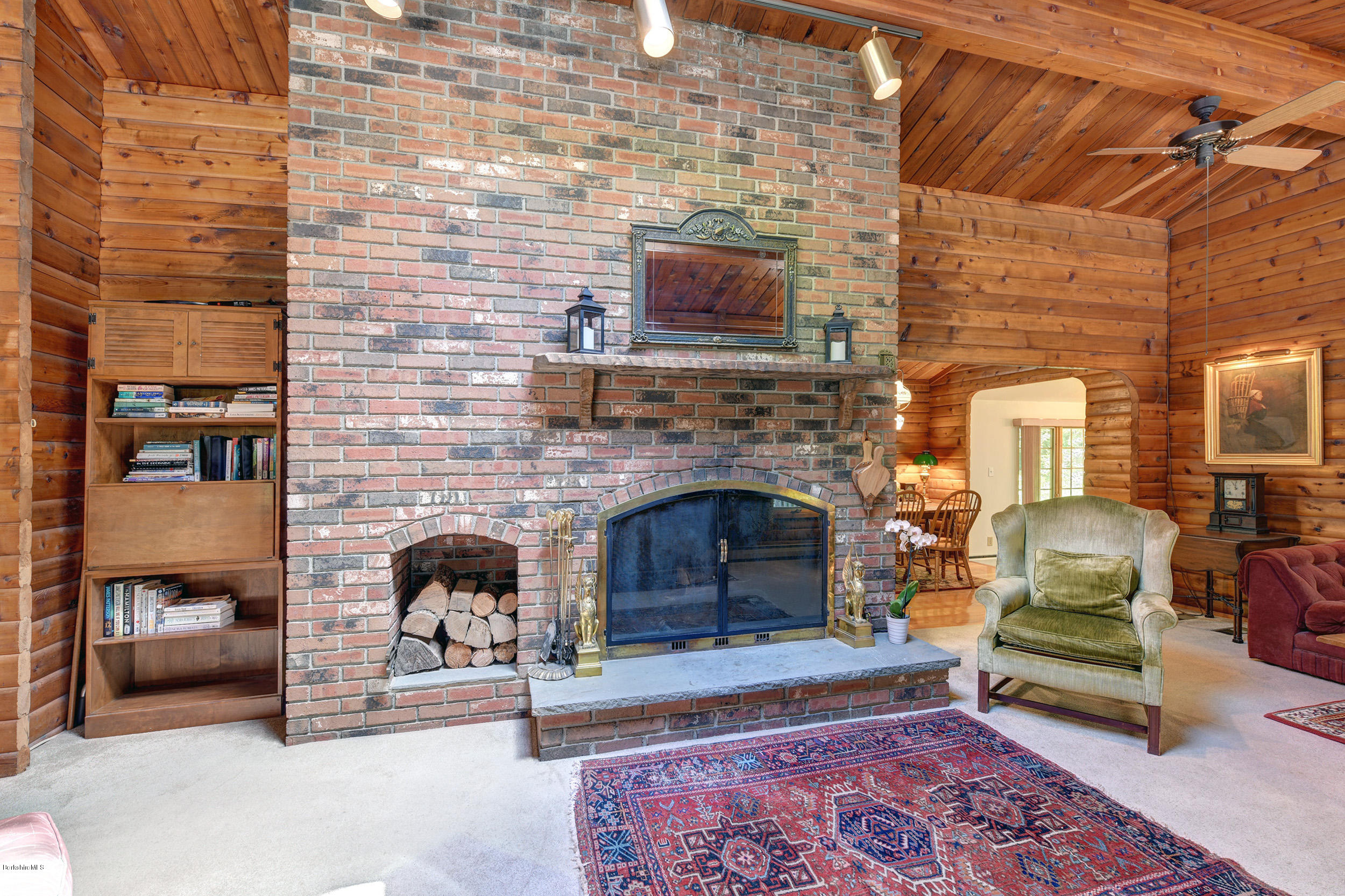 2399 Swamp Road Richmond, MA 01254 - Photo 9 of 36 a living room with furniture and a fireplace