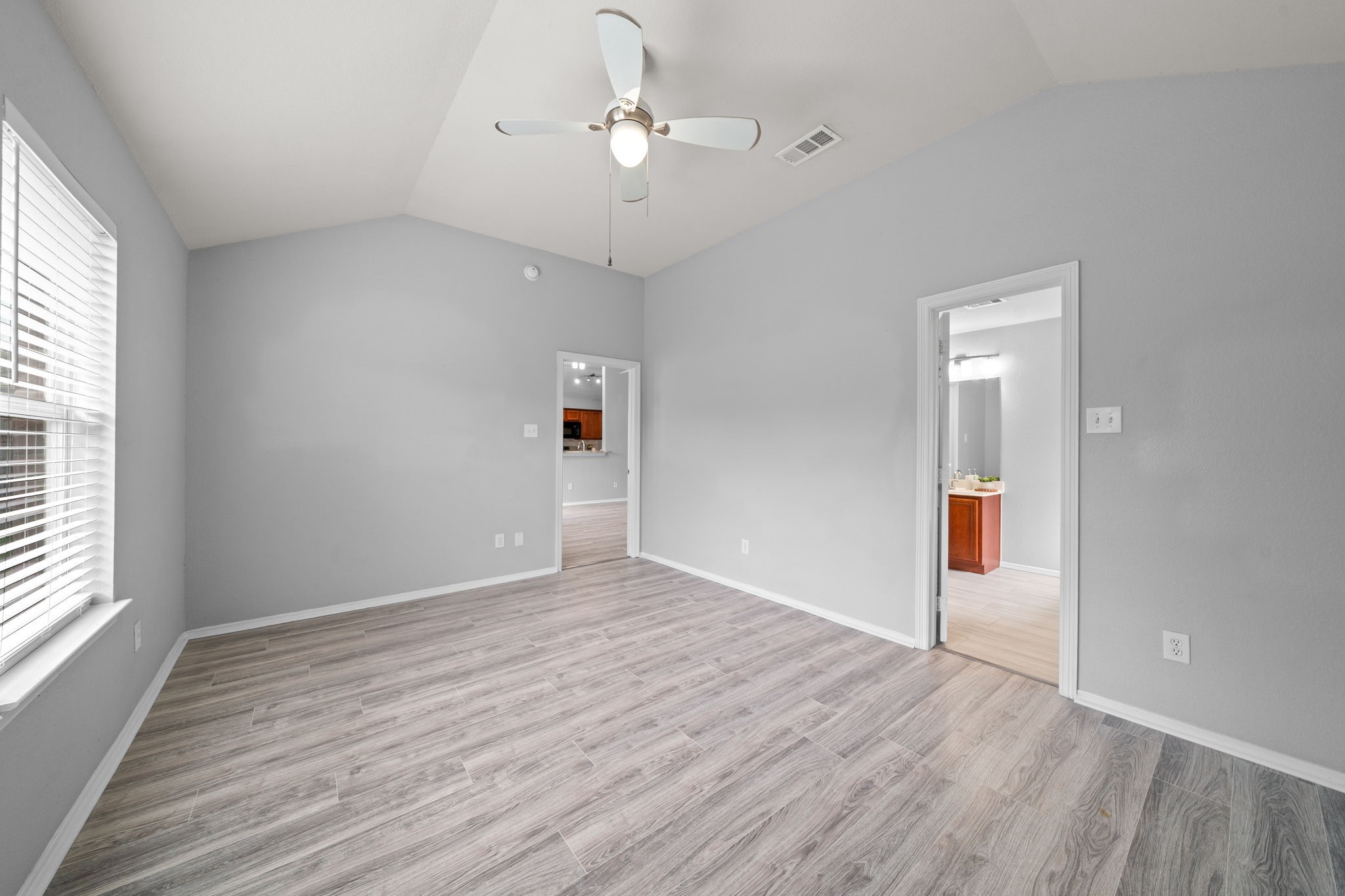 694 St Croix Alvin, TX 77511 - Photo 11 of 30 wooden floor in an empty room with a window