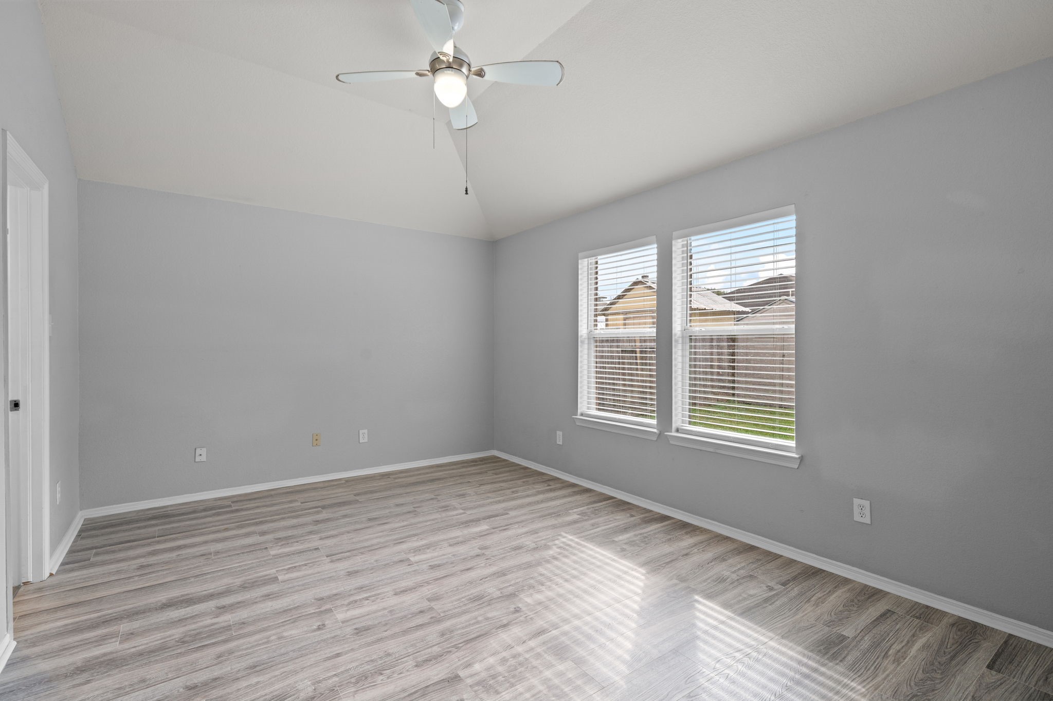 694 St Croix Alvin, TX 77511 - Photo 12 of 30 wooden floor in an empty room with a window
